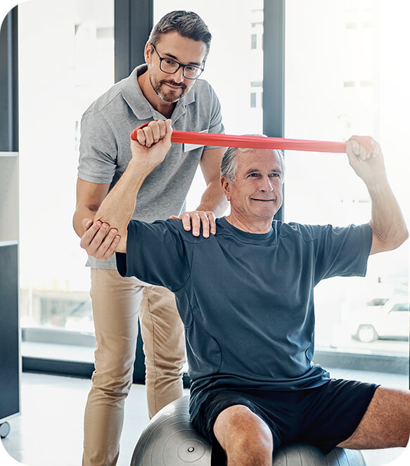 Therapist help old man in exercise